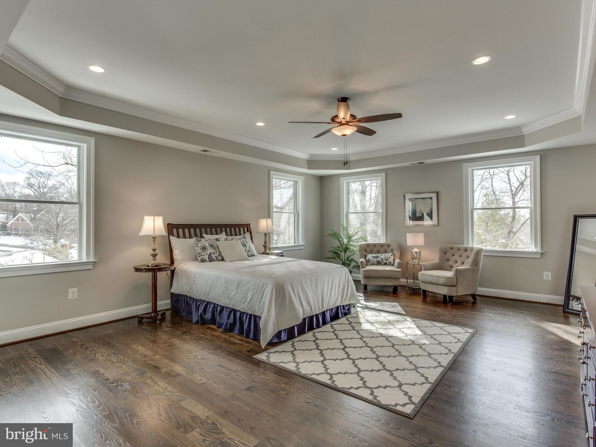 3100 North Rochester Street Arlington, VA 22213 - Photo 19 of 30 a spacious bedroom with a bed a couch and a window