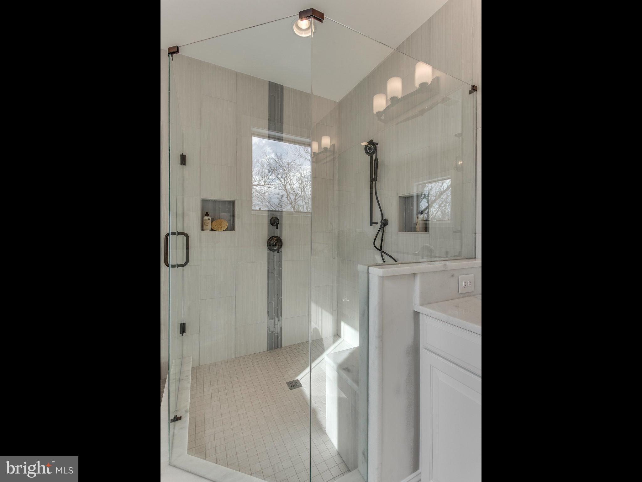 3100 North Rochester Street Arlington, VA 22213 - Photo 22 of 30 a bathroom with a sink and mirror