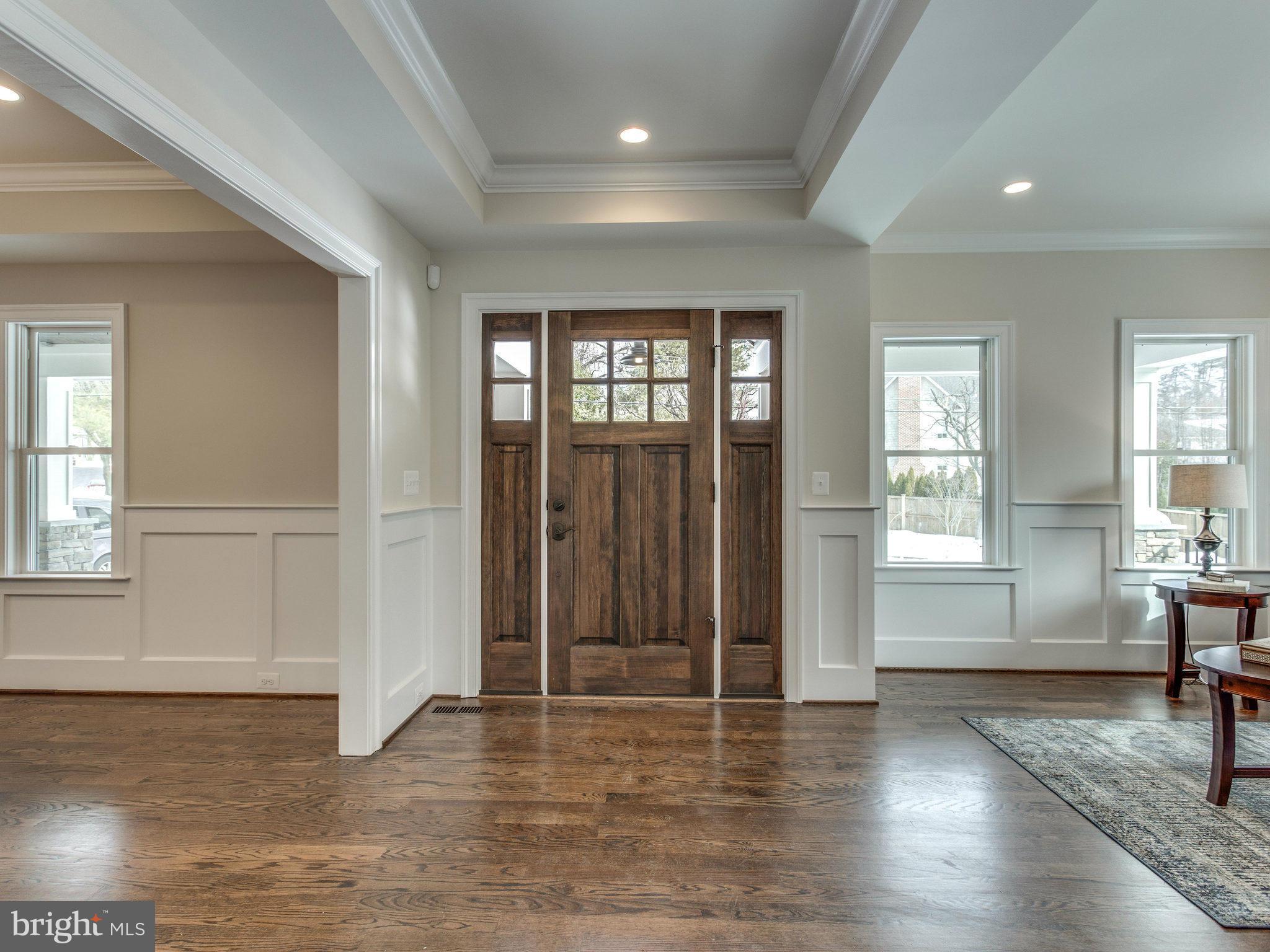 3100 North Rochester Street Arlington, VA 22213 - Photo 6 of 30 an empty room with wooden floor and windows