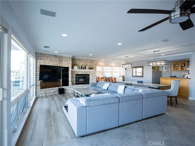 a living room with furniture fireplace and flat screen tv