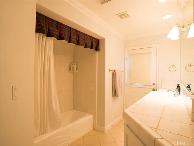 a bathroom with a bathtub and shower