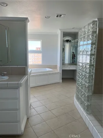 a bathroom with a bathtub and a sink