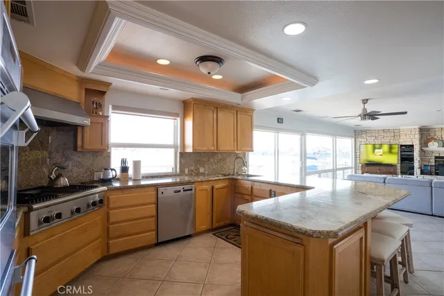 a kitchen with a stove a sink and a refrigerator
