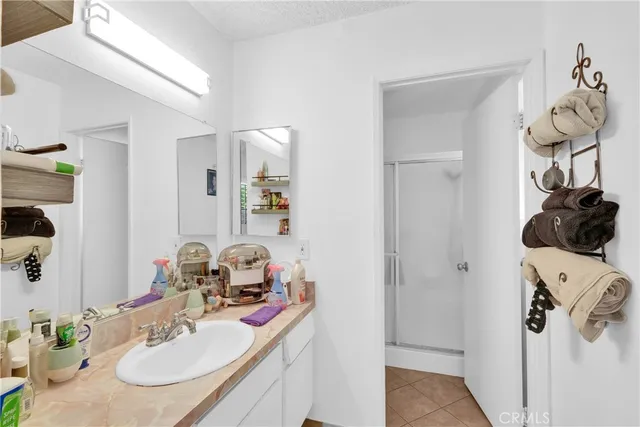 a bathroom with a sink vanity and mirror