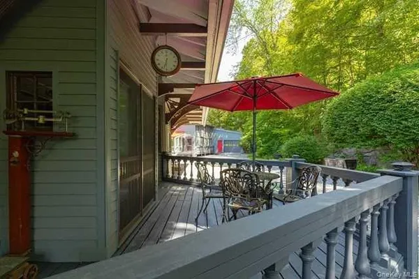 a view of balcony with furniture