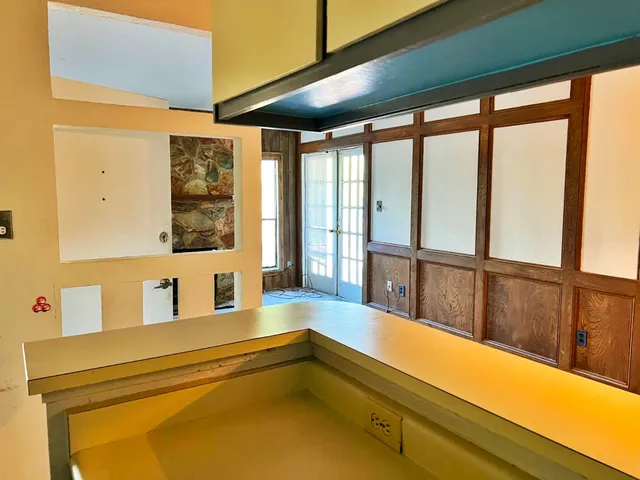 a bathroom with a large window and a bathtub