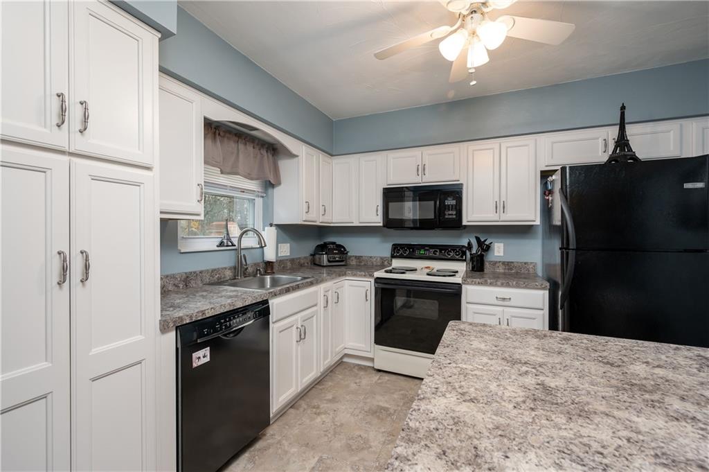 146 Hampton Court Butler, PA 16002 - Photo 8 of 25 a kitchen with stainless steel appliances granite countertop a refrigerator sink and stove