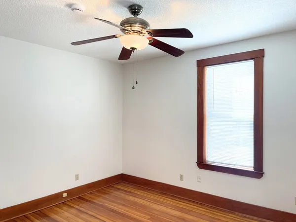 a view of room with window and ceiling fan