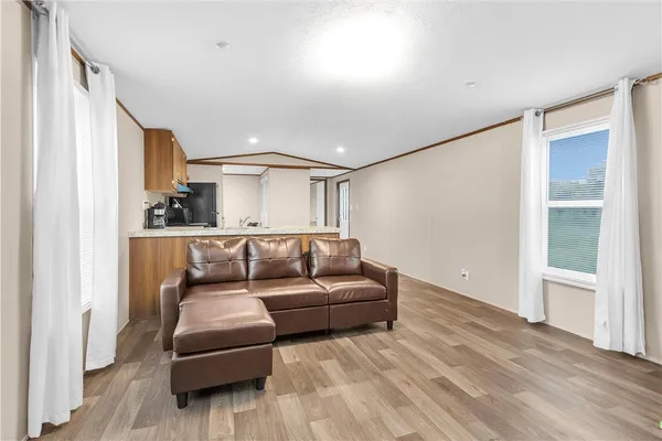 a living room with furniture and a window
