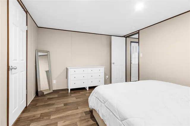 a large white bed in a white room