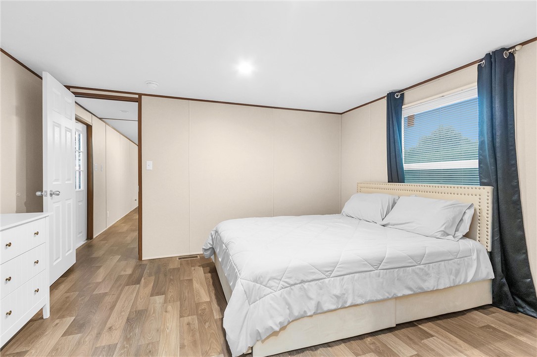 17708 Sweed Road Washington, TX 77880 - Photo 16 of 27 a bedroom with a large bed and a window