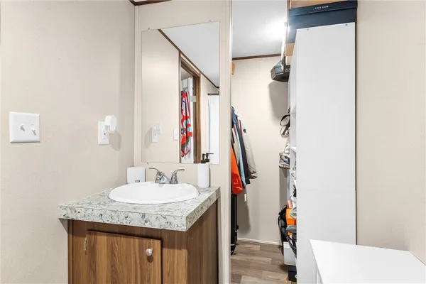 a bathroom with a sink and a mirror