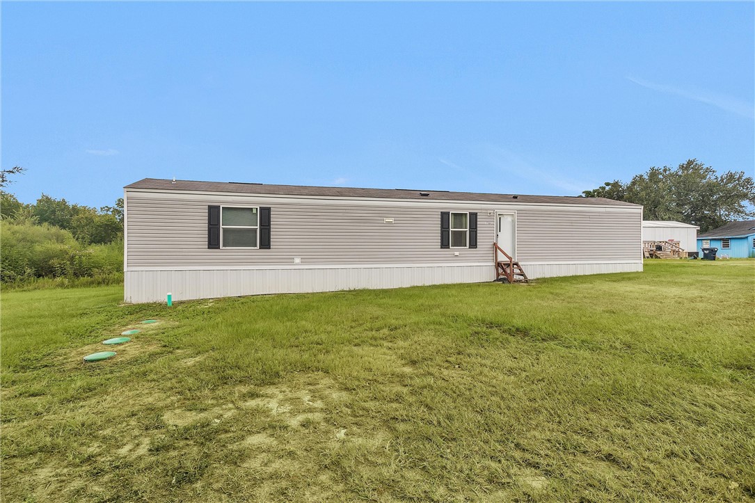 17708 Sweed Road Washington, TX 77880 - Photo 4 of 27 a front view of house with yard and seating area