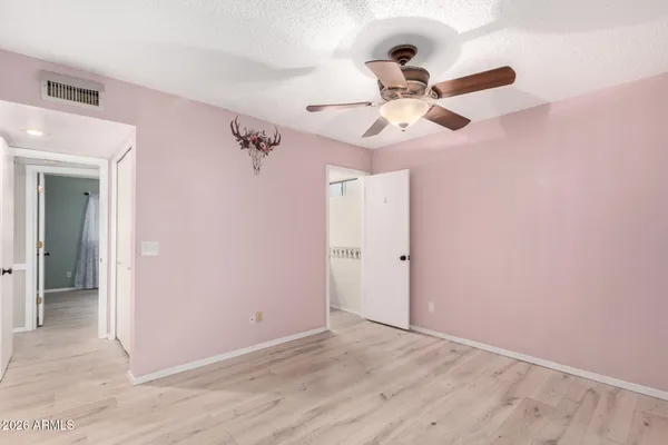 a view of a kitchen with a sink and a refrigerator