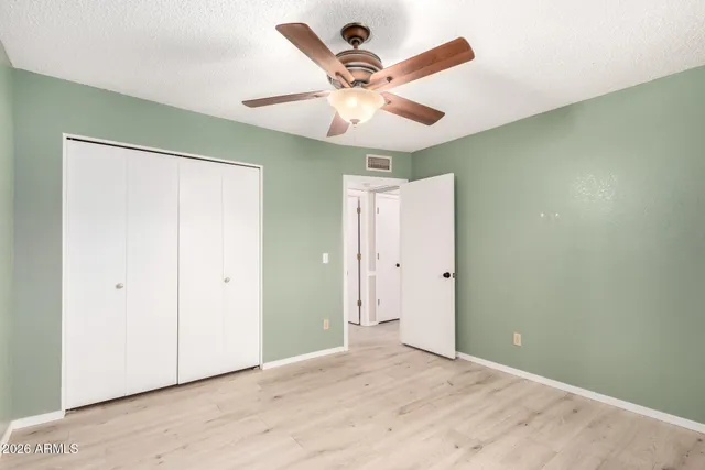 a bathroom with a sink vanity mirror and toilet