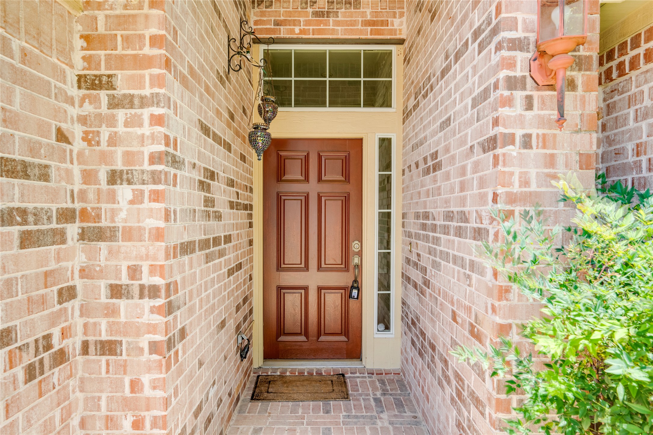 1813 Nelson Ranch Loop Cedar Park, TX 78613 - Photo 4 of 39 A classic brick exterior entry with a charming wood door and transom window invites you home.