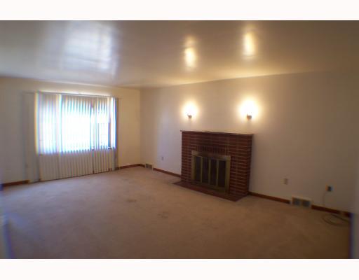 2279-2281 Brodhead Road Aliquippa, PA 15001 - Photo 7 of 8 Living Room. brick fireplace in the livingroom of 2281 Brodhead Road