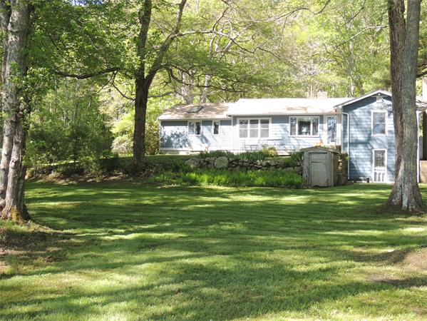 536 Snipatuit Road Rochester, MA 02770 - Photo 17 of 25 a front view of a house with a garden
