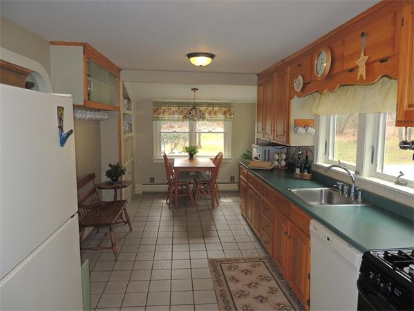 536 Snipatuit Road Rochester, MA 02770 - Photo 2 of 25 a kitchen with stainless steel appliances granite countertop sink stove and cabinets