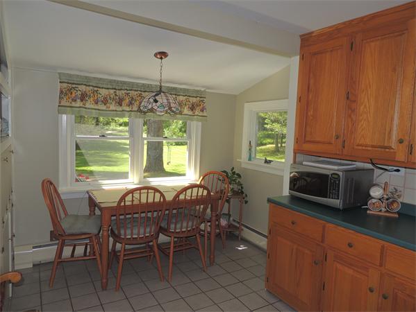 536 Snipatuit Road Rochester, MA 02770 - Photo 3 of 25 a view of a dining room with furniture window and outside view