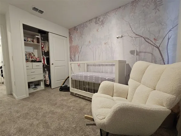 a room with furniture and white walls