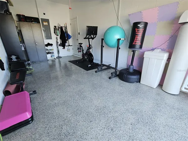 a room with gym equipment and a window