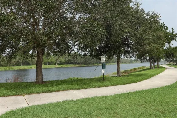a view of a lake with a yard