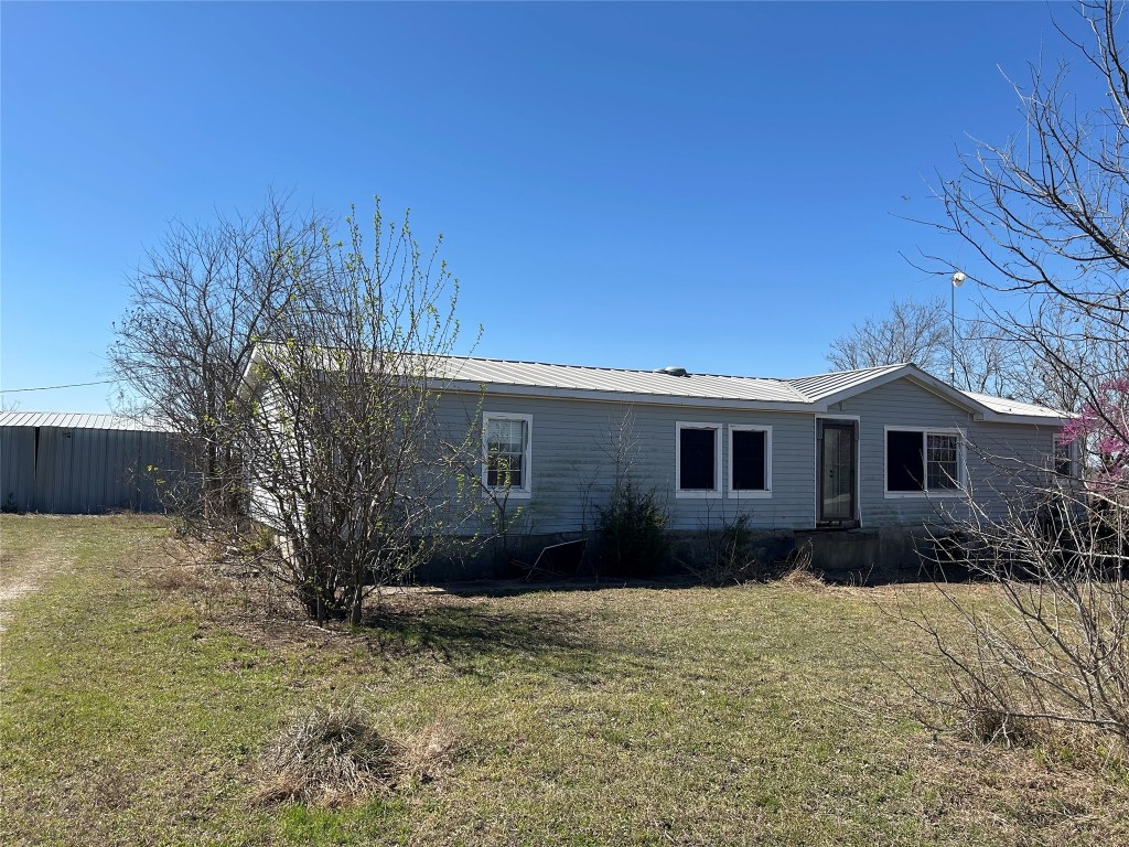 20406 Wilson Road, Unit B Coupland, TX 78615 - Photo 1 of 14 a house view with a backyard space