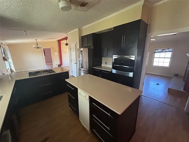 a kitchen with a stove and a microwave