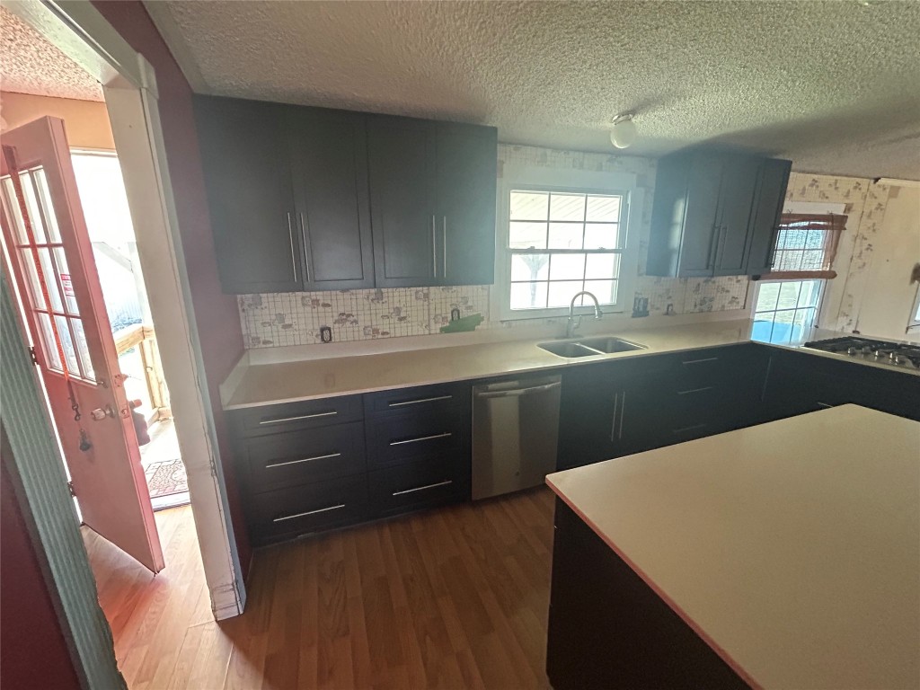 20406 Wilson Road, Unit B Coupland, TX 78615 - Photo 4 of 14 a kitchen that has a sink and a stove in it