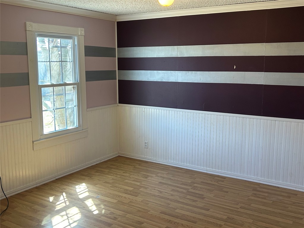20406 Wilson Road, Unit B Coupland, TX 78615 - Photo 7 of 14 a view of room with window and hardwood floor