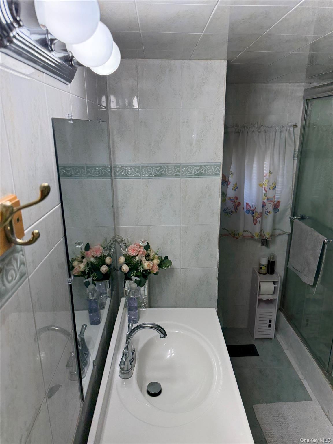 136 Quaker Rd Park Pomona, NY 10970 - Photo 15 of 24 Bathroom vanity with integrated sink and chrome faucet