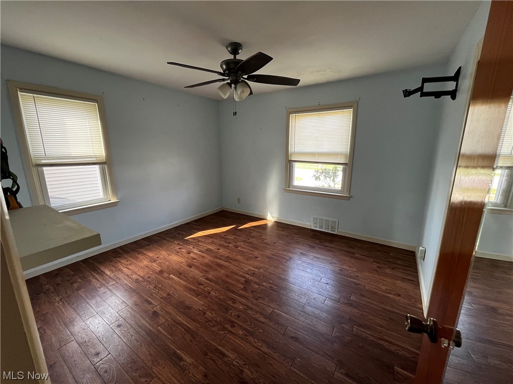 30824 Clarmont Road Willowick, OH 44095 - Photo 10 of 24 Empty room with dark hardwood / wood-style flooring and ceiling fan