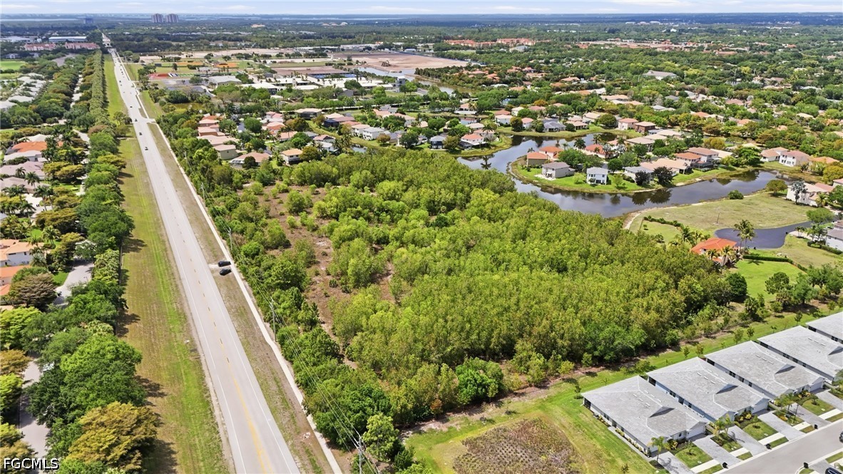 Williams Road Estero, FL 34135 - Photo 11 of 16 an aerial view of residential houses with outdoor space