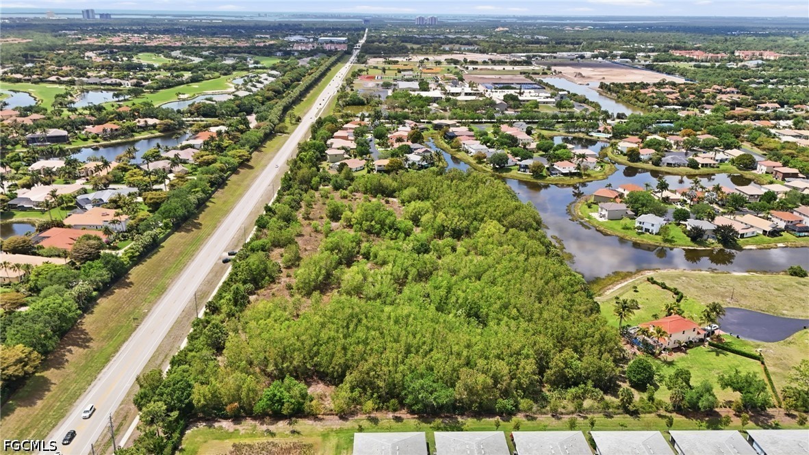 Williams Road Estero, FL 34135 - Photo 12 of 16 an aerial view of residential houses with outdoor space