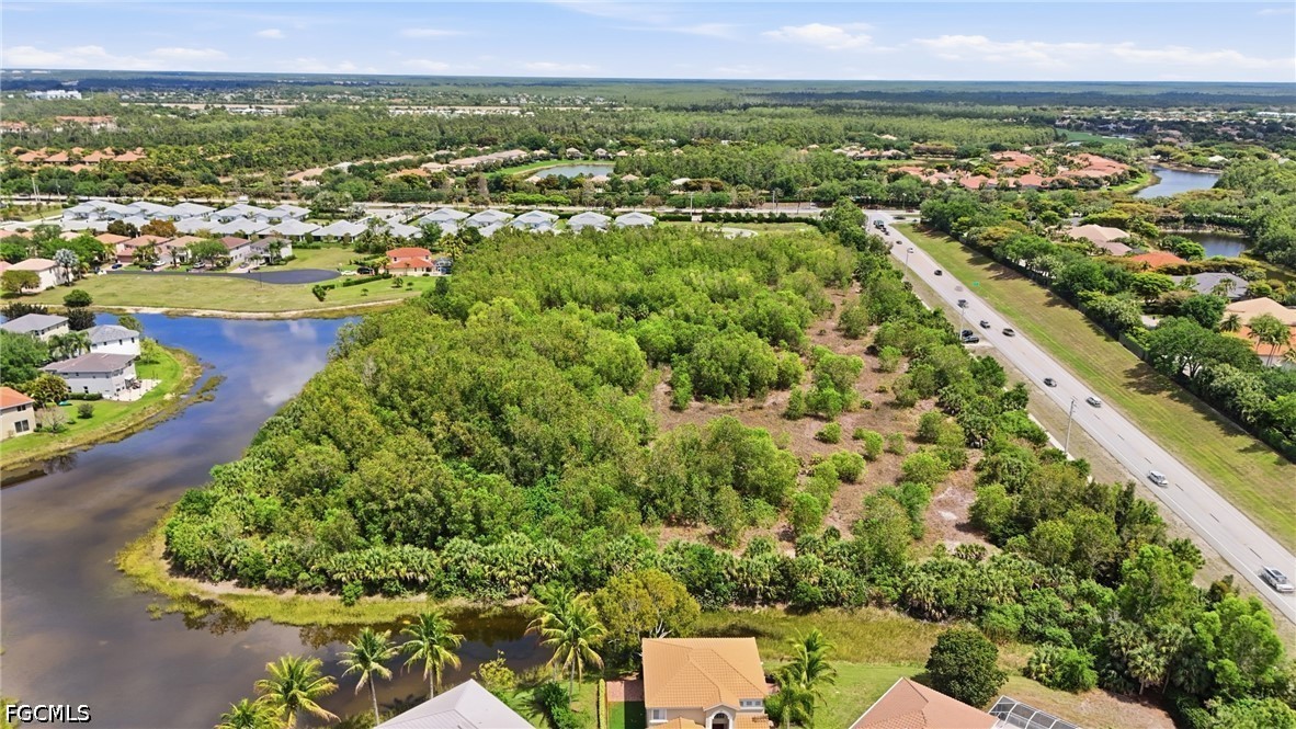 Williams Road Estero, FL 34135 - Photo 16 of 16 an aerial view of residential houses with outdoor space and trees