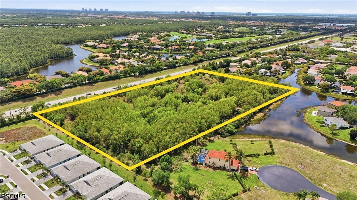 Williams Road Estero, FL 34135 - Photo 5 of 16 an aerial view of residential houses with outdoor space