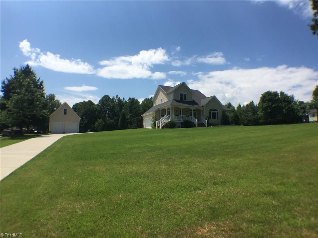 8275 Coldwater Road Stokesdale, NC 27357 - Photo 2 of 30 View of House and Detached Garage from front