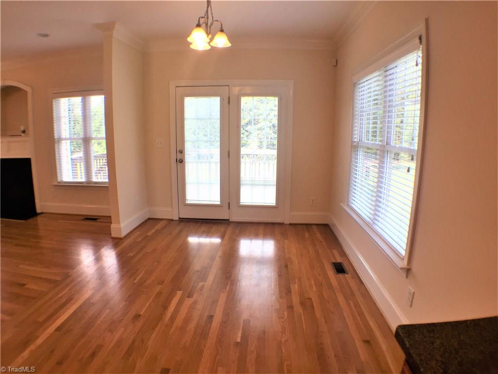 8275 Coldwater Road Stokesdale, NC 27357 - Photo 11 of 30 Breakfast Room with doors leading to Deck