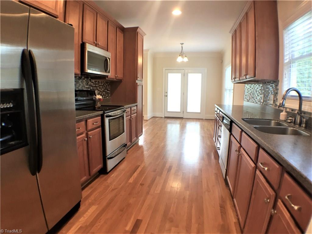 8275 Coldwater Road Stokesdale, NC 27357 - Photo 9 of 30 Kitchen Looking towards Breakfast Area
