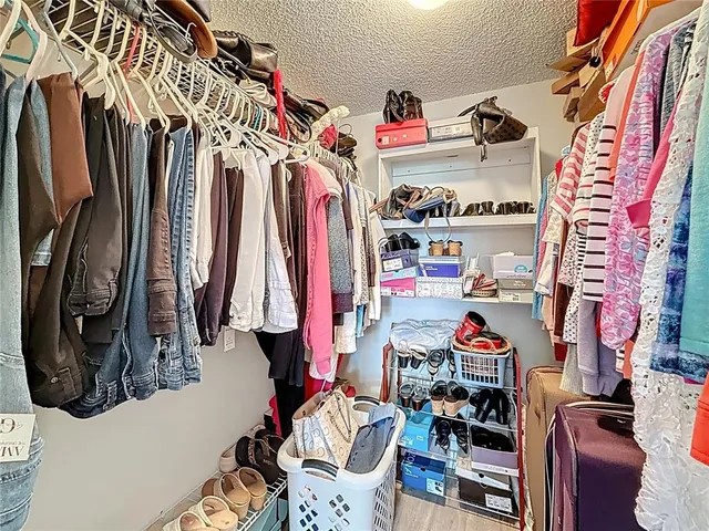 a bathroom with a sink a toilet a mirror a vanity and shower