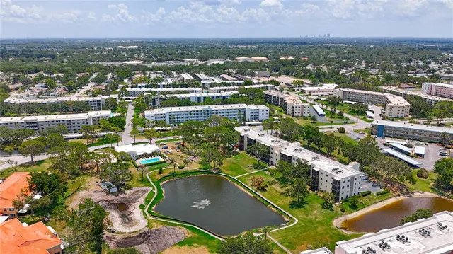 a living room with furniture a flat screen tv and a rug