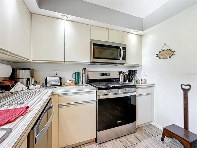 a dining room with furniture and a chandelier