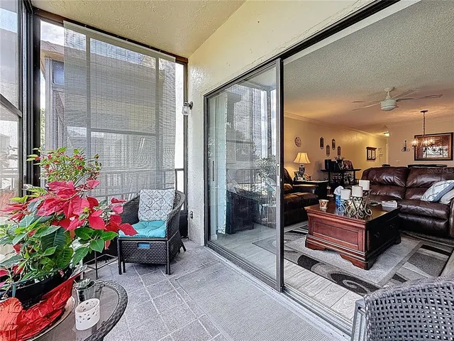 a kitchen with granite countertop a refrigerator and a stove top oven