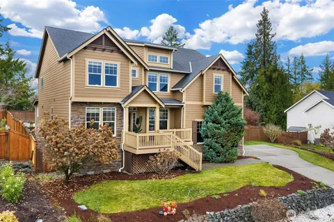 a front view of a house with a yard and porch