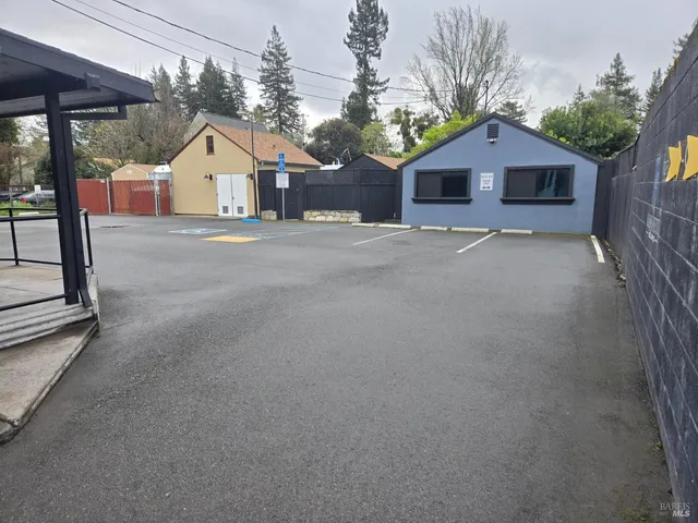 a view of a house with a yard and garage