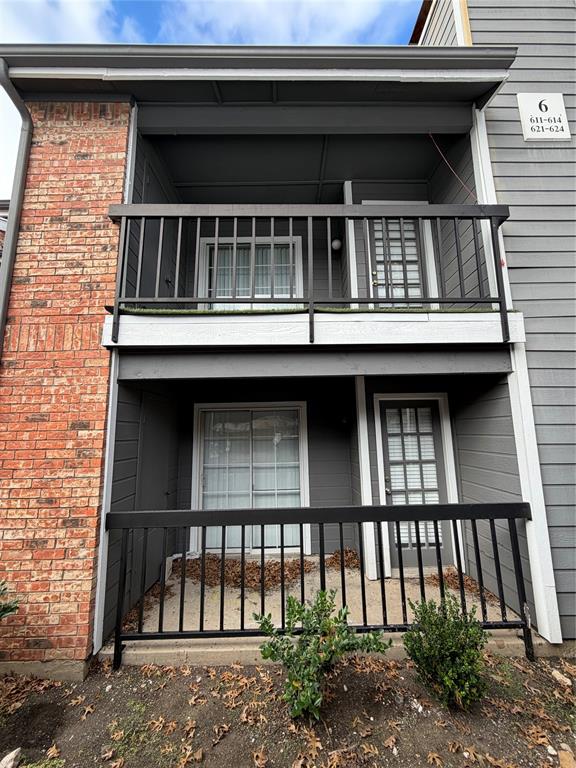 18333 Roehampton Drive, Unit 622 Dallas, TX 75252 - Photo 25 of 28 a view of a brick house with large windows