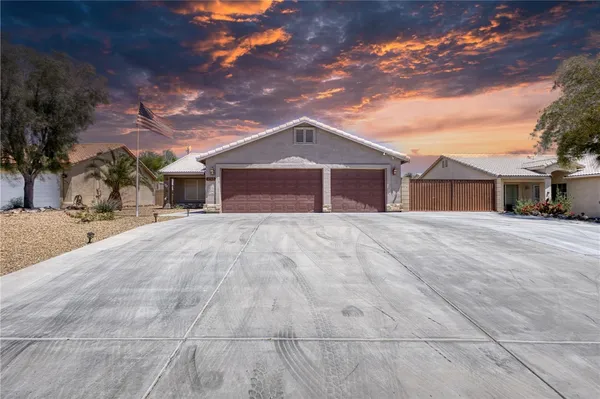 a view of house with yard and entertaining space