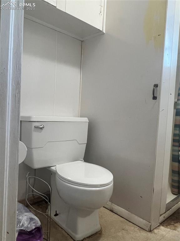 955 Golden Street Calhan, CO 80808 - Photo 12 of 25 a white toilet sitting next to a bathroom sink