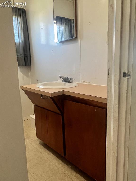 955 Golden Street Calhan, CO 80808 - Photo 13 of 25 a room with a sink and a mirror